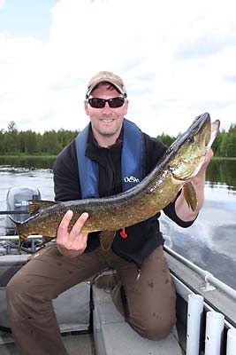 Fishing for giant pike at a wilderness lake